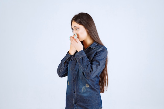 Free photo young woman holding her head as she is tired or has headache