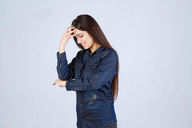 Young woman holding her head as she is tired or has headache