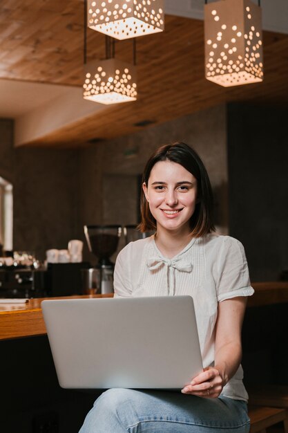 Young woman holding laptop 