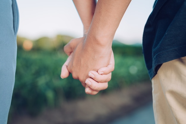 Young woman holding man's hand vacation travel