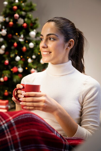 Young woman holding a red cup