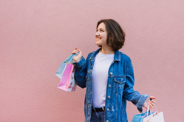 Young woman holding shopping bags