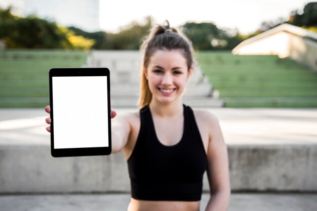 Young woman holding a tablet