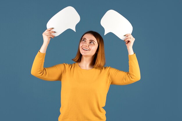 Young woman holding a thought bubble