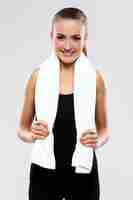 Free photo young woman holding towel