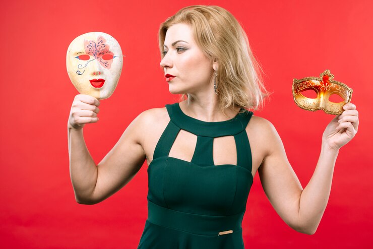 Free Photo young woman holding two masks in hands