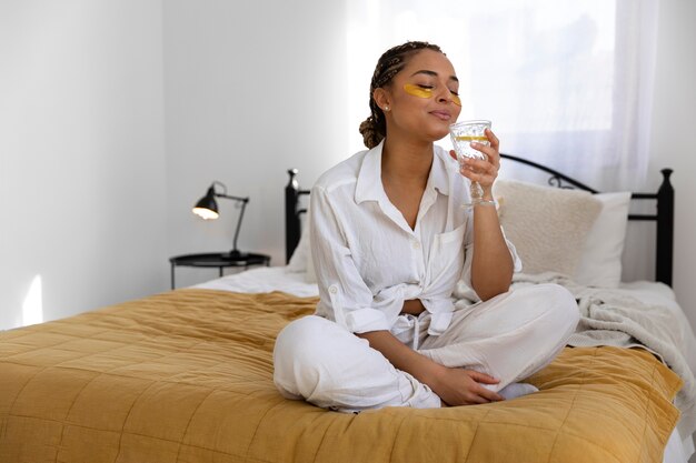 Young woman at home doing her beauty routine