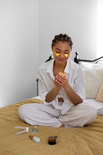 Young woman at home doing her beauty routine