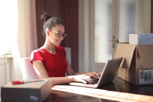 young woman at home uses a computer