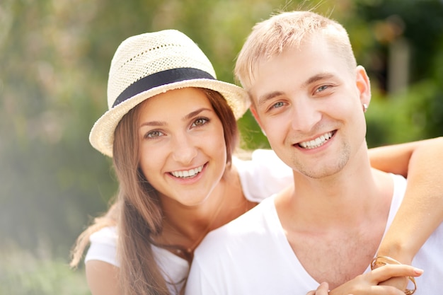 Young woman hugging her boyfriend