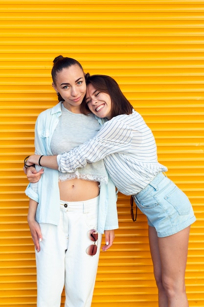 Young woman hugging her friend