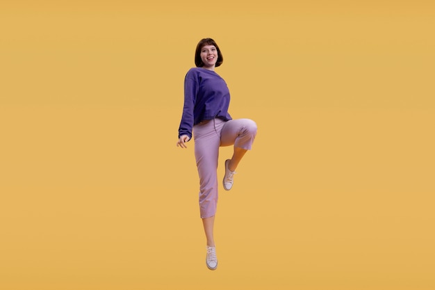 Молодая женщина прыгает изолированной на оранжевом