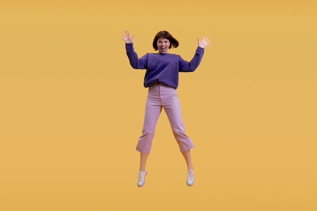 Young woman jumping isolated on orange