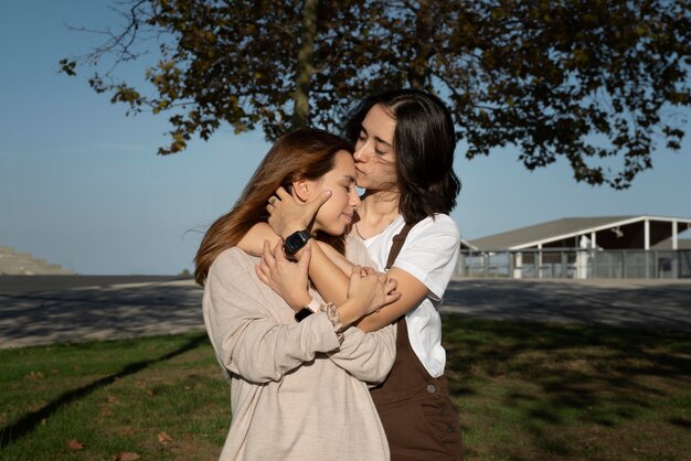 Young woman kissing her girlfriend