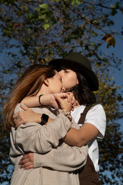 Young woman kissing her girlfriend