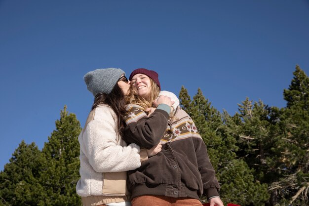 Young woman kissing her lover during trip