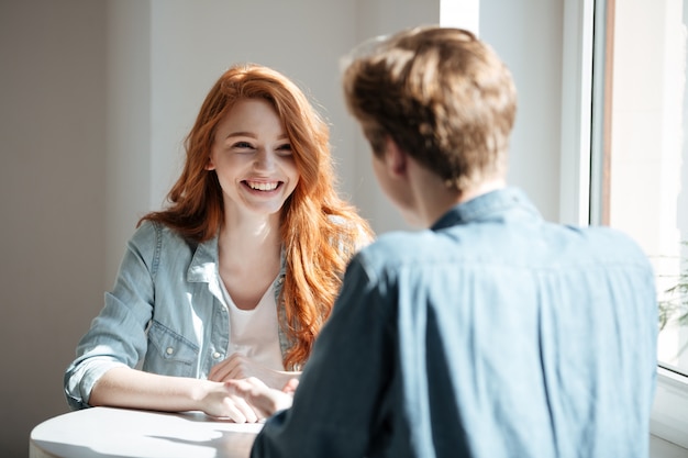 Young woman laughing in cafe