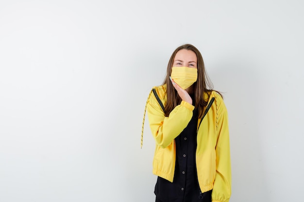 Young woman leaning chin on palm