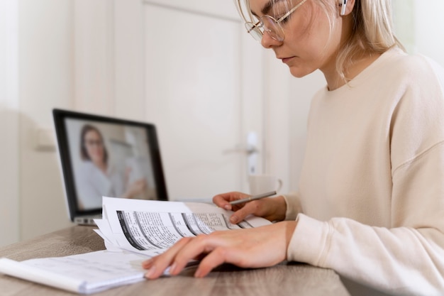 Young woman learning english from her teacher