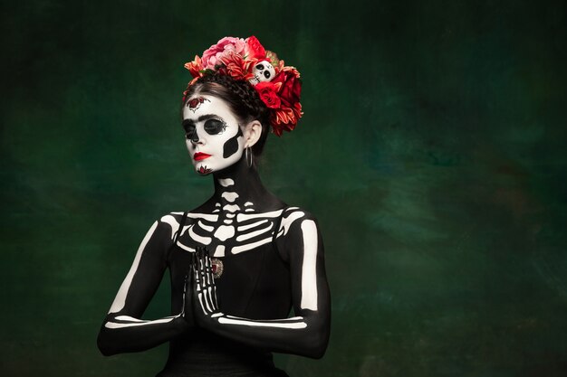 Young woman like Santa Muerte Saint death