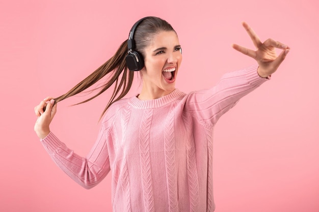 Young woman listening to music in headphones