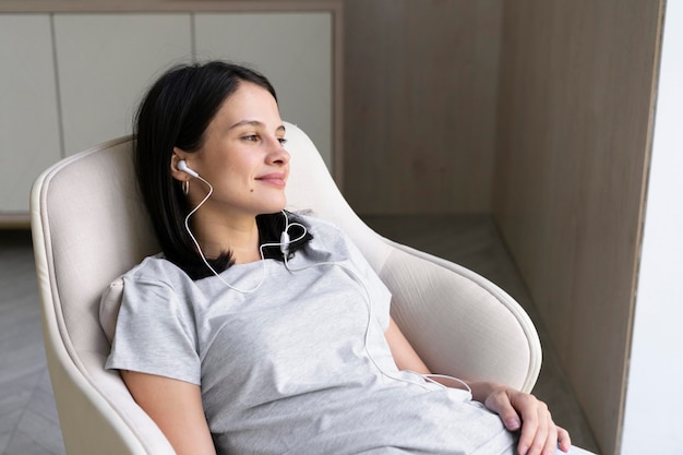 Young woman listening to music at home