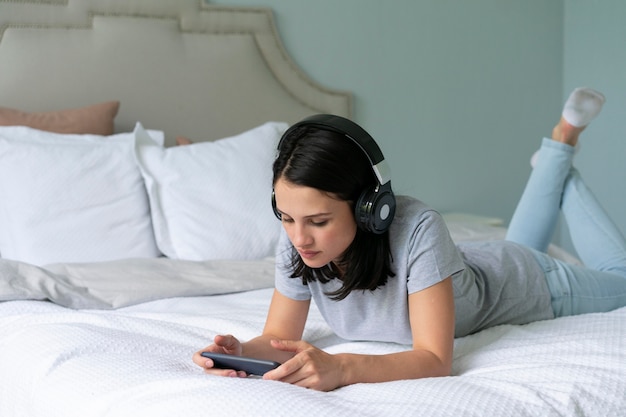 Young woman listening to music at home