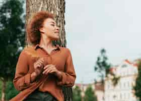 Free photo young woman looking away with copy space