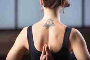 Free photo young woman making namaste behind the back, studio evening pract