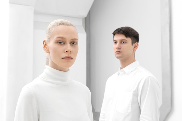 Free photo young woman and man wearing white clothes