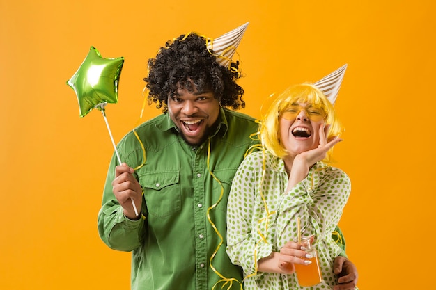 Young woman and man with party balloon