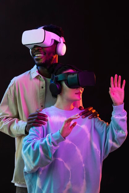 Young woman and man with vr glasses