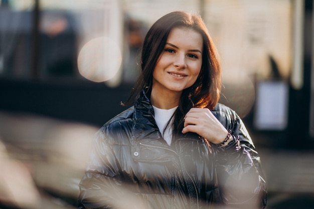 Free photo young woman model posing outside the street