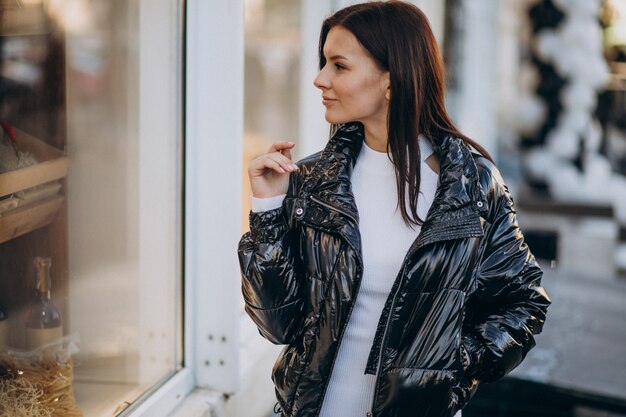 Young woman model posing outside the street