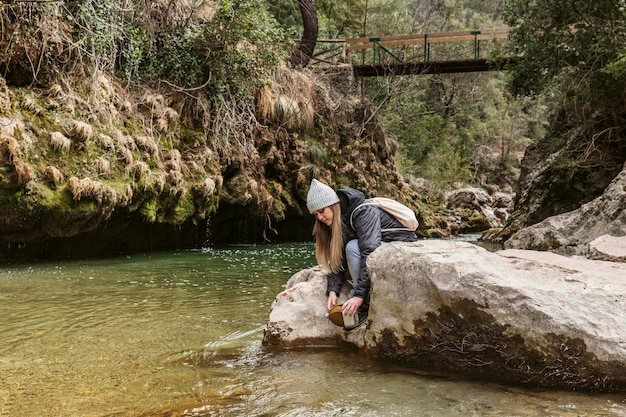 Young woman in nature at river