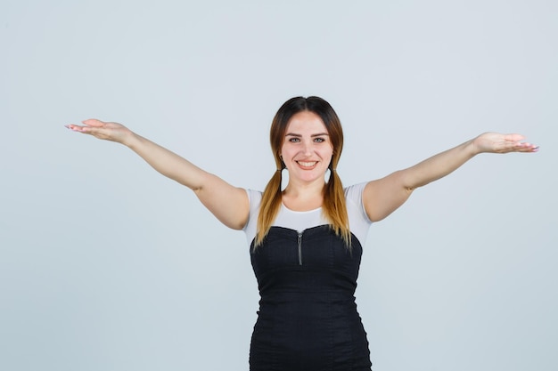 Free photo young woman opening arms for hug