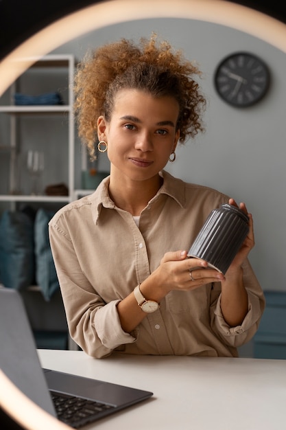 Free photo young woman organizing live shop