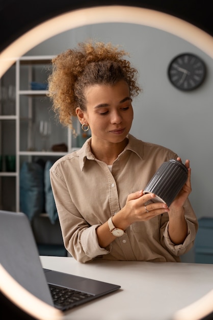 Young woman organizing live shop