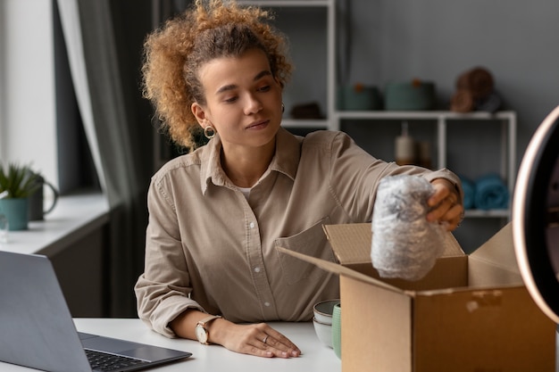 Young woman organizing live shop