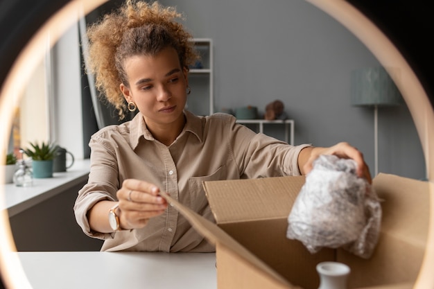 Young woman organizing live shop