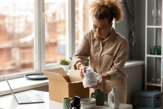 Free photo young woman organizing live shop