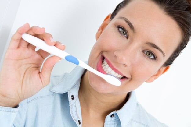 young woman picking his teeth