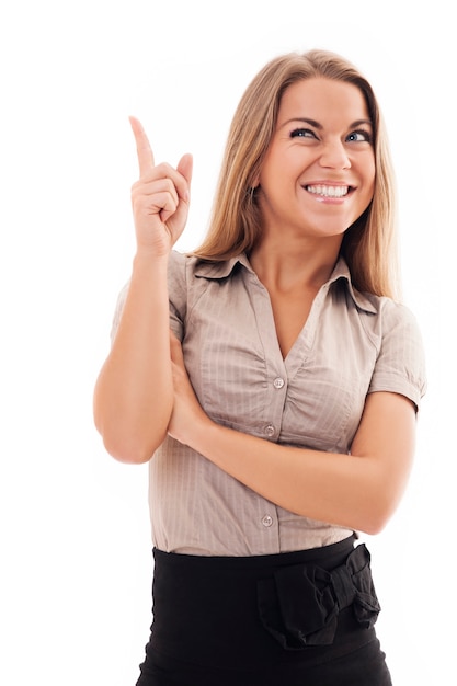 Young woman pointing up