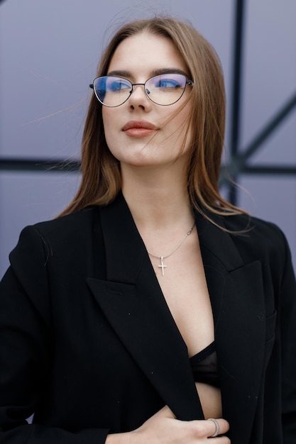 young woman portrait outdoor in black wear