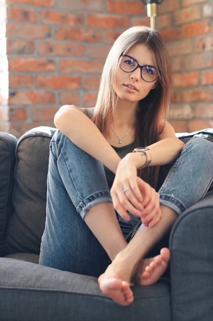 Young woman posing inside the home