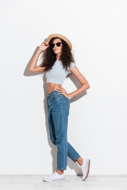 Young woman posing isolated over white