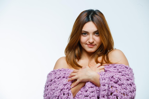 Young woman posing in knitwear