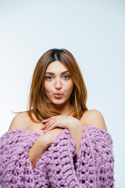 Young woman posing in knitwear
