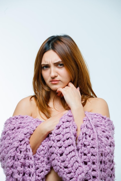 Young woman posing in knitwear