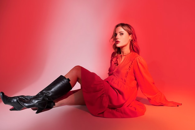 Young woman posing in red dress  full shot